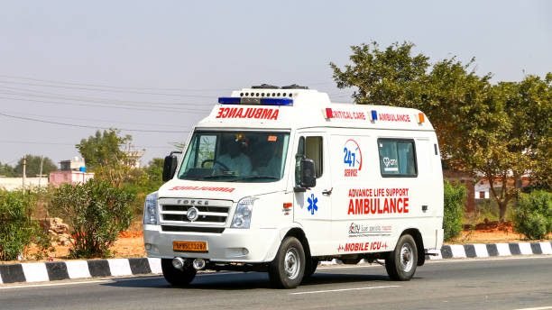 Rajasthan, India - March 2, 2022: Ambulance car Force Traveller at an interurban road.