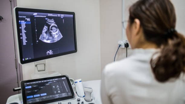 Doctor is screening pregnant woman in the hospital